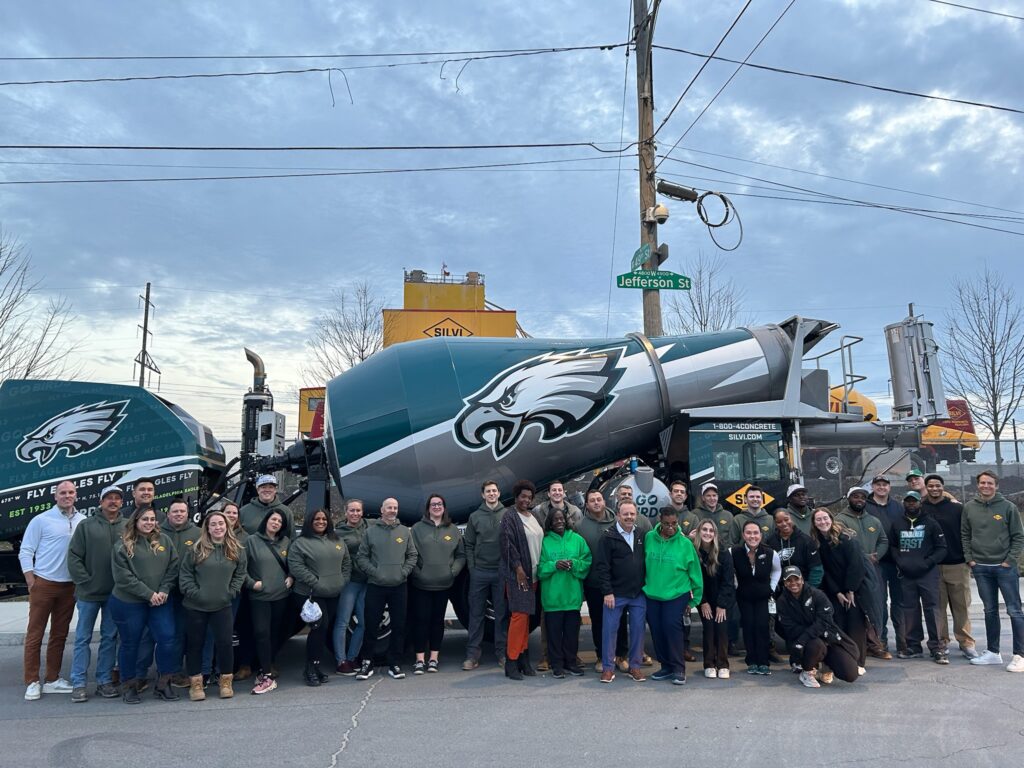 Silvi Materials' staff pose for a picture at the company's holiday food drive in partnership with the Philadelphia Eagles.